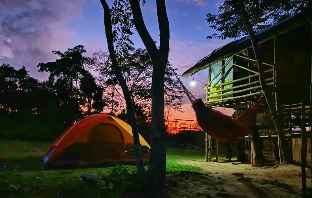 Golden-hour view at Green Yard Eco Resort in Narayanpur, Assam